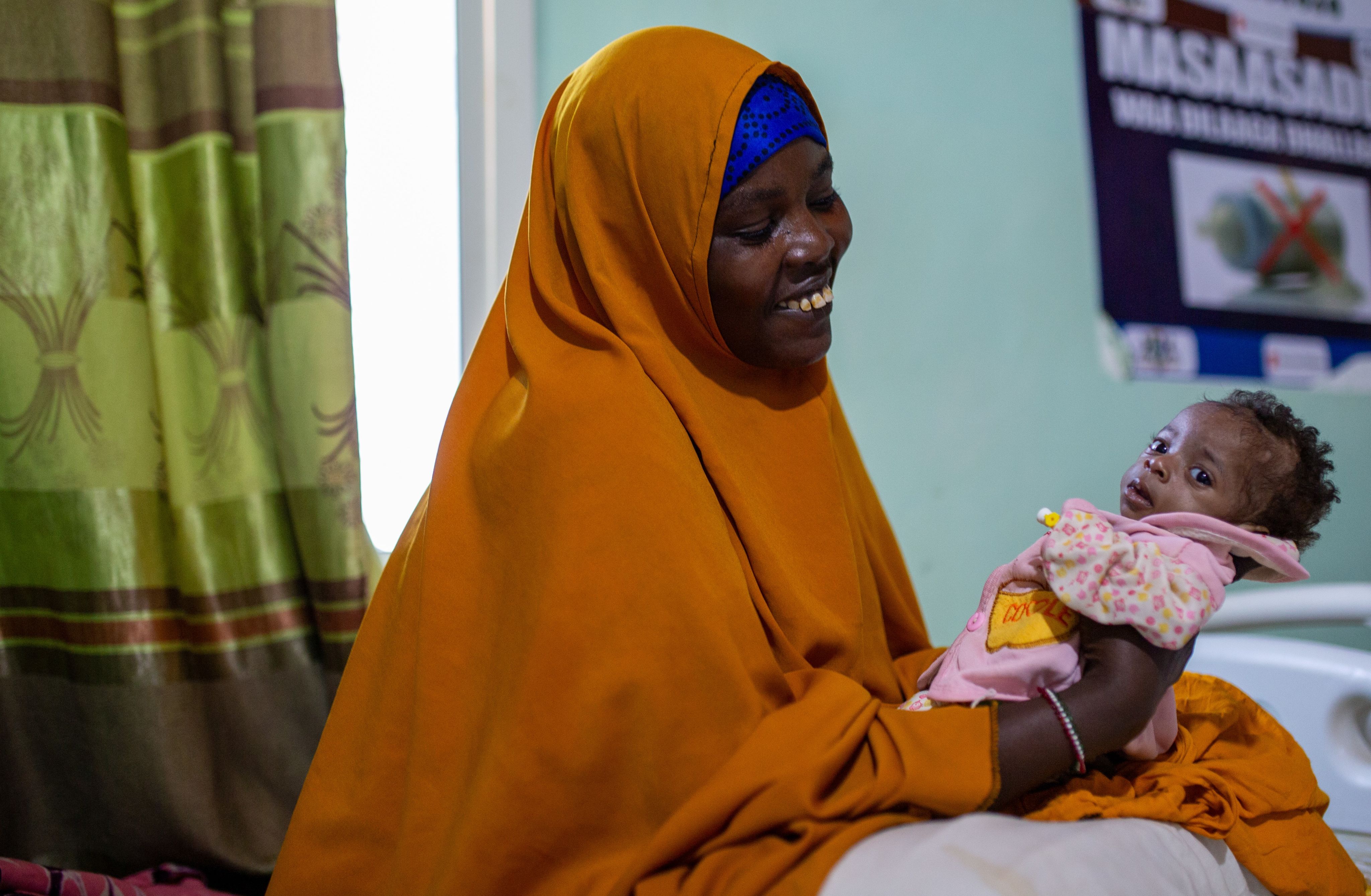 Photos: Baby Kamila*, 5 months, held by her mother, is recovering from malnutrition in Somalia.Credit: Mustafa Saeed / Save the Children.