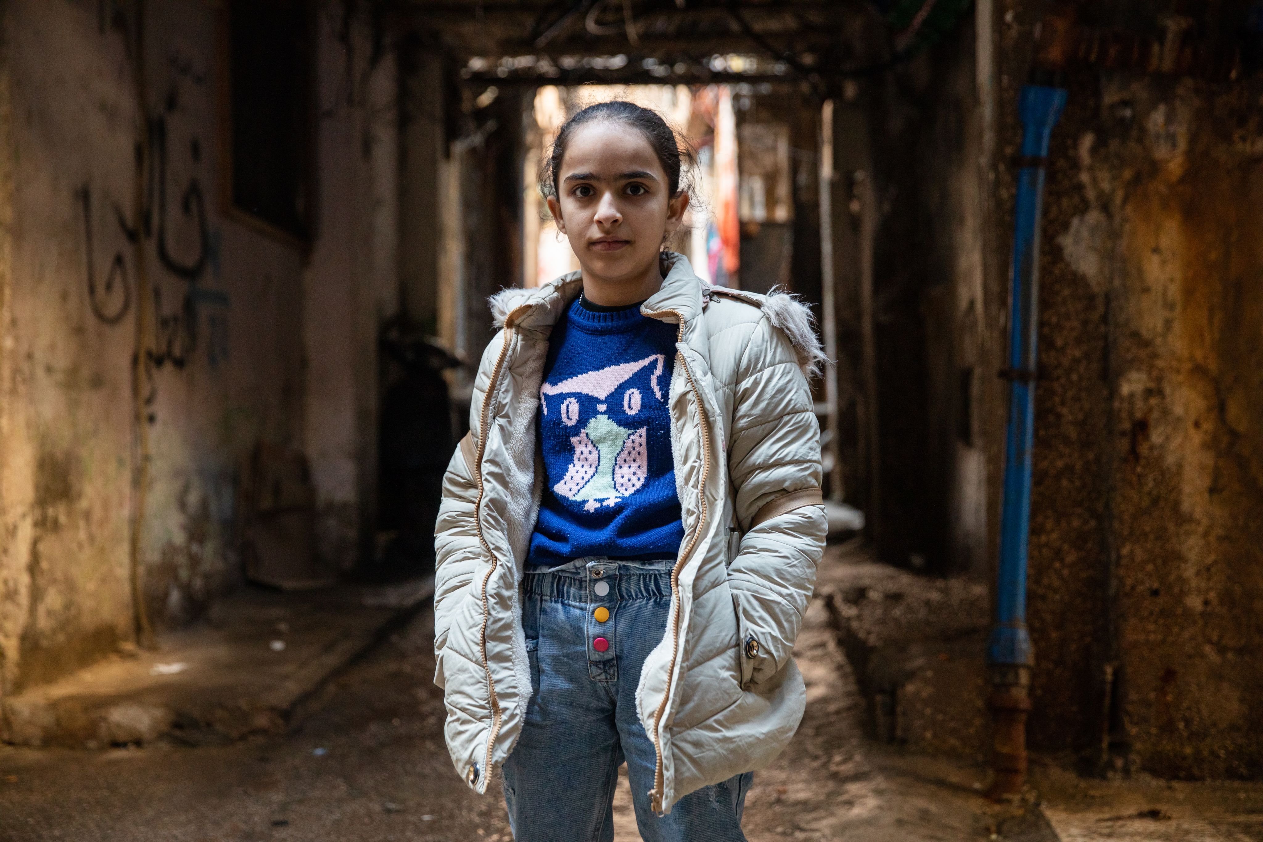 Ghinwa*, 13, in a refugee settlement where she lives, in Beirut, Lebanon